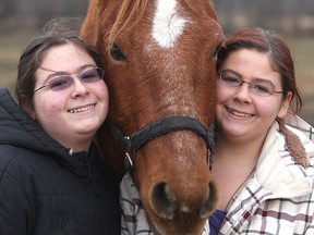 Twin sisters Kaitlynn and Kourteney Lappan, at their home northwest of Kingston with one of their horses, have autism but both have proved successful in the horse ring.
Michael Lea The Whig-Standard