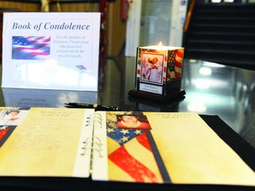 A book of condolences for victims of the school shooting in Newtown, CT, sits in the main foyer of city hall Monday. (RONALD ZAJAC/The Recorder and Times)