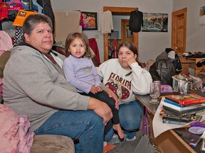BRIAN THOMPSON, The Expositor

Matthew Butler poses with two of his daughters, Madison, 3, and Amber, 21, inside their Brock Street home, which was ransacked on the weekend. Stolen were televisions, gaming systems, games, tools and Christmas presents.