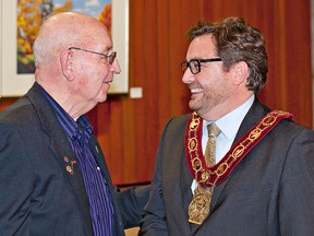 BRIAN THOMPSON, The Expositor

Former Brantford mayor Bob Taylor chats with Mayor Chris Friel prior to Friel's annual address to city council Monday.