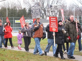 Teachers with the Lambton Kent District School Board participate in a one-day strike in Chatham, Ont. on Tuesday, Dec. 18, 2012, to protest Bill 115, which has imposed a wage freeze and cuts to sick days without going through the collective bargaining process. (ELLWOOD SHREVE, Chatham Daily News)