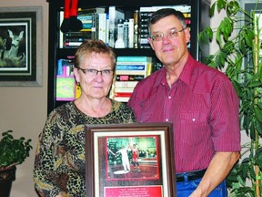 Gail and Sheldon King hold a plaque honouring their son Micheal, who tragically lost his life 20 years ago this January.