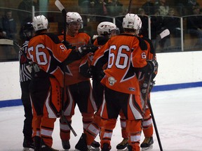 The Fairview Flyers congratulate each other after scoring one of six goals during a game against the Slave Lake Wolves at the Fairplex arena on Saturday, Dec. 14, 2012. It was the first of two home games for the Flyers. (Simon Arseneau/Fairview Post)