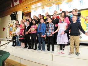 Grade 5 students sing.