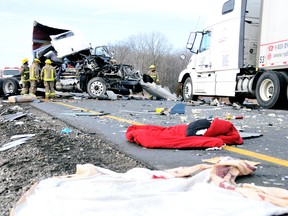 Debris from a sheared cab litter Highway 401 east of Communication Road interchange after a three-transport-trailer collision early Tuesday, December 18, 2012 in Chatham, On. It was the second crash involving transports within 10 km Tuesday. (DIANA MARTIN, Chatham Daily News)