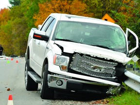 The truck involved in a fatal motor vehicle collision on the 1000 Islands Parkway on Oct. 17, 2012 is shown damaged and at rest against a guard rail (RECORDER AND TIMES FILE PHOTO).