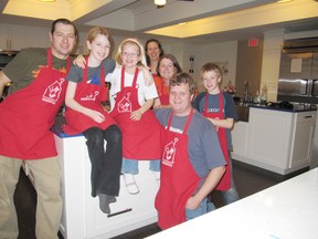 Sarah Sollors and Aurora Jacobi, (shown in this file photo from 2012, second and third from left) are once again supporting Ronald McDonald's House with a fundraising "family swim" event at Centennial Pool in Port Elgin on Dec. 27. The girls have teamed to raise almost $4,000 for Ronald McDonald House over the past four years (Postmedia Network file photo)