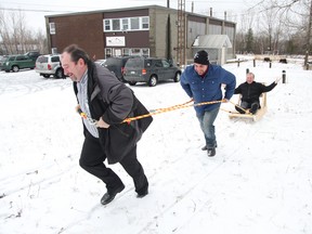 A group of volunteers demonstrate a human dog sled race at the Sudbury Winterfest launch at the Sudbury Trail Plan office in Garson on Tuesday, December 18, 2012. The festival will be held on the shores off Moonlight Beach from Feb. 15-17, 2013. See video at www.thesudburystar.com (JOHN LAPPA/THE SUDBURY STA)