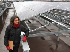 Debra Krakow, project manager for the city's real estate and construction services, stands on the roof of Utilities Kingston's vehicle maintenance and storage building where solar panels have now been activated.
Michael Lea The Whig-Standard