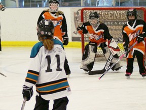 Krista Punter, number 11 of Team Wight's U10 ringette squad, moves in to score a goal in the second half of the game against Cambridge on Sunday, Dec. 9, 2012. SUBMITTED PHOTO