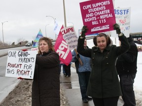 Local CUPE members rally against Bill 115 at the Lakeshore Drive overpass on Tuesday. (PJ WILSON The Nugget)