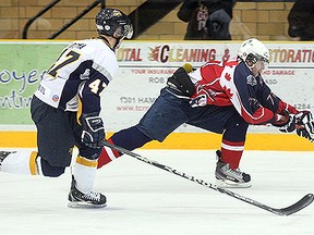 North Bay Jr. A Trappers forward Tait Seguin reaches for the puck during a recent NOJHL game at Memorial Gardens. The team is for sale with the organization reaching out for new local owners.