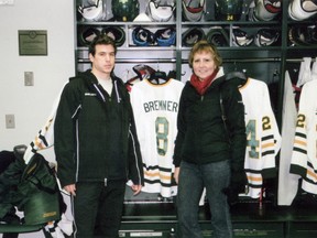 Dan Bremner, left, and his mom Judy in the SUNY Oswego locker room in January 2011. Bremner spent the first part of this hockey season away from his professional team in Knoxville, Tenn. to finish his degree, fulfilling the wishes of Judy, who died of cancer in November 2011. SUBMITTED PHOTO/THE OBSERVER