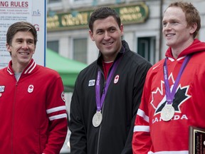 Kingston's Olympians, from right, silver-medal winning rowers Will Crothers and Rob Gibson, along with marathoner Dylan Wykes, were honoured on Wednesday with keys to the city at a ceremony at Market Square in downtown Kingston. 
Jeff Peters For the Whig