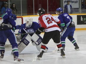Blind River Beavers forward Tyson MacLeod (24) battles for the puck in heavy traffic on Saturday, Dec. 15 at the Blind River Community Centre.
Photo by REG CLARK/FOR THE STANDARD