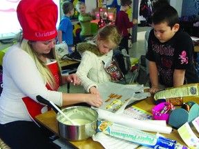 Amanda Flanagan helps grade one students Brooklyn Sawchuk and Keithan Sutherland make cookies in her classroom at La Verendrye School, Wednesday. (ROBIN DUDGEON/PORTAGE DAILY GRAPHIC/QMI AGENCY)