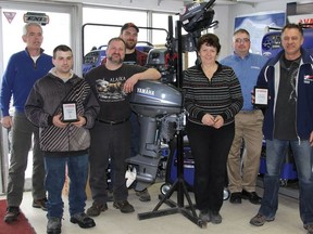 Bourque's Auto Sales received two awards for retails sales in September and October. The Bourque's team gathered for a staff photo with their new awards. Back row (l-r): Pat Doyle, Sandy Ewen and Troy Vaillancourt, District Sales Manager for Yahama; front row (l-r): Guy Vigneault, Rodney Charpentier, Rachelle Girard and Gerry Bourque, owner.
