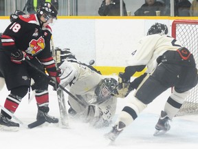 Trenton Golden Hawks' Andrew Winsor makes a save on Newmarket Hurricanes' Calvin Higley during the Hawks' 2-0 win Sunday at the Community Gardens. The shutout moved Winsor into top spot among OJHL goaltenders with a 2.21 goals against average.