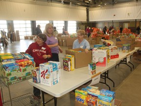 Around 100 volunteers came out to help sort and make hampers for the less fortunate. The donations were brought to the Stony Plain Pavillion and grouped together by size and type.