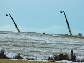 Cranes stand where the fieldhouse had been previously. PHOTO BY AMANDA PAWLITZKI