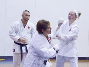 Mother and daughter Teri-Lynn and Ashley Campbell spar against each other during the karate ranking.