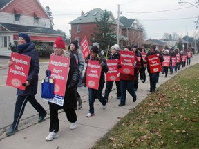 A group of elementary school teachers make their way around the former Elmdale Public School Thursday. TVDSB elementary school teachers set up picket lines to protest the Bill-115 which they call an infringment on their rights to negotiate contracts. (Nick Lypaczewski Times-Journal)