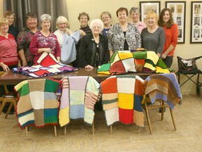 Pictured in the back row, from left to right,  with their donations at their meeting December 4 are: Thelma Kennedy, Bev Ryan, Margaret Thompson, Peggy Call, Eunice Shennette, Bev Coltman and Cathy Purcell. Front row from left to right: Audrey Lamont, Rose Blackwell, Agnes Stewart, Linda Walton and  Marilyn Stewart.