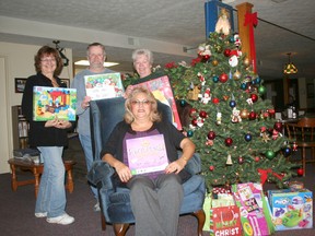 Pictured in the back row from left to right: Angela Hupalo of Iota Phi, Bob Harrison of the Port Elgin Legion, Nancy Smith of Iota Phi and Rhonda Harrison of the Port Elgin Legion.