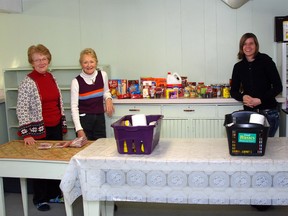 Bruce Mines Food Bank volunteers (left to right) Connie Bennett, Carol Keenan and Angela Bennett prepare for a busy Christmas season.