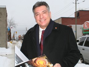 Ontario Liberal leadership candidate Charles Sousa made a stop in Timmins Thursday to discuss his platform, leading up to the party's leadership convention being held in Toronto next month. Sousa, seen here leafing through Veins of Gold, the Timmins centennial anniversary book put together by Karen Bachmann, is one of seven candidates seeking to replace Premier Dalton McGuinty as Liberal leader.
