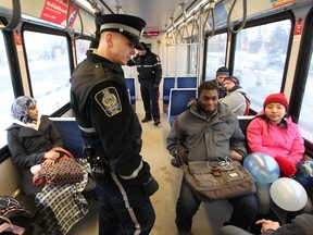Edmonton Transit Peace Officer Terry MacDonald patrols a south bound LRT car in Edmonton, Alta. on Thursday Dec. 20, 2012. The Edmonton Police Service has started the End of the Line crime prevention initiative, which promotes the sharing of information between the Edmonton Police Service, Edmonton Transit Service Peace Officers and shopping mall security personnel. David Bloom/Edmonton Sun/ QMI Agency