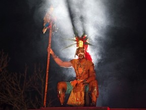 A Mayan priest sits atop a pyramid as Richard Garriott addresses guests at his "End of the World Soiree" dress rehearsal in Austin, Texas, December 19, 2012. Picture taken December 19, 2012. REUTERS/Erich Schlegel (UNITED STATES - Tags: SOCIETY ENTERTAINMENT)