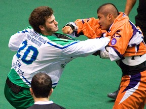 QMI file photo

Merit Precision Jr. (left) of Peterborough and Danny Vyse of Six Nations exchange punches during a playoff game last season. The Canadian Lacrosse Association is taking aim at fighting with tougher penalties.