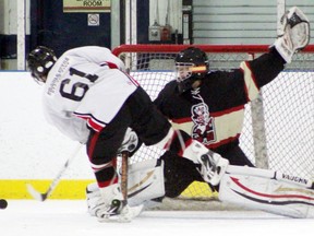 Gananoque's Tyler Murray's shot is denied by Brockville's Nathan Peters during the shootout of the Islanders game against the Tikis on Sunday. Brockville won the game 3-2.
