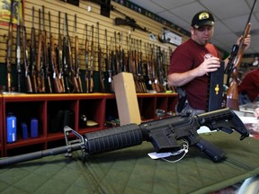 A Palmetto M4 assault rifle is for sale at the Rocky Mountain Guns and Ammo store in Parker, Colorado, outside of Denver. The killing of 12 people at a midnight screening of the latest Batman movie in the Denver suburb of Aurora is another of the mass shootings to wrack the United States in recent months.