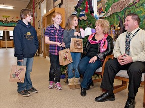 BRIAN THOMPSON, The Expositor

Major Ballachey School students Wesley Turner (left), Aislinn Millette and Brittany Leggett talk with Christine Pizzey and principal Grant McKinnell about Child Hunger Brantford's free lunch program which will begin in January at the Rawdon Street elementary school.