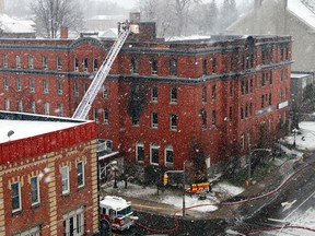 Belleville, Ont. fire crews put out some hot spots left in what is left of Quinte Hotel in downtown Belleville, Ont., after a spectacular overnight-blaze destroyed the downtown landmark building overnight Thursday, Dec. 20, 2012. (Friday, Dec. 21, 2012)   JEROME LESSARD/The Intelligencer/QMI Agency