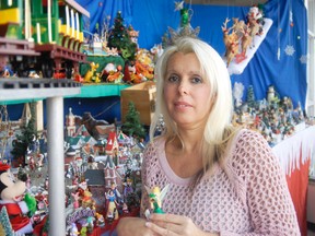 Ida McAuley, with Tinkerbell, shows off some of the hundreds of collectables gathered over 14 years that are on display in The Square between Goderich Grill and Scoopers.