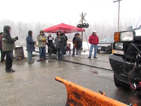 About a dozen demonstrators with the Aamjiwnaang First Nation in Sarnia, Ont. blocked the CN line on their reserve Friday, Dec. 21 to protest the federal government's Bill C-45. They said they staged the impromptu blockade to support the thousands expected to participate in the Idle No More demonstration in Ottawa. (CATHY DOBSON, Sarnia Observer)