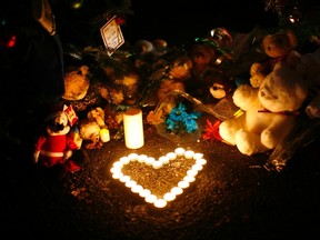 Candles, stuffed animals and other items are seen Thursday at an impromptu memorial for victims of the deadly December 14 shooting at Sandy Hook Elementary school in Newtown, Conn. Columnist Bob Ripley says the story of Christmas is tinged with sadness because of the slaughter of babies ordered by King Herod following Christ’s birth. Herod’s henchmen didn’t use assault rifles, but they would have done so, he theorizes. (Eric Thayer, Reuters)