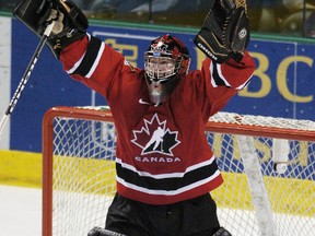 2005 Team Canada goaltender Jeff Glass celebrates his team's gold medal win at the World Junior Hockey Championships in Grand Forks, North Dakota, January 4, 2005. Canada beat Russia 6-1. The 2005 junior team finished with the gold medal. Canada's gold medal win was one of the five in a row they won between 2005 to 2009.  (REUTERS/Shaun Best)