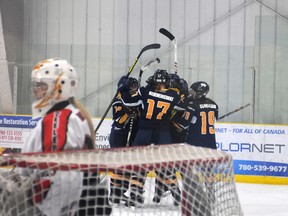 TERRY FARRELL/DAILY HERALD-TRIBUNE
Storm players celebrate their third goal of the first period on Lloydminster goalie Kayla Robinson during a Dec. 15, 4-1 victory in Alberta Major Midget Female Hockey League play. The Storm head into the Mac’s Midget AAA Tournament riding a 12-game undefeated streak in AMMFHL play.