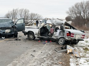 A Volvo travelling northbound on Vanneck Rd. lost control north of McEwan Dr. and was struck by a southbound Ford Escape, police said. The driver and passenger in the Volvo, along with a dog, died at the scene. CRAIG GLOVER/THE LONDON FREE PRESS/QMI AGENCY