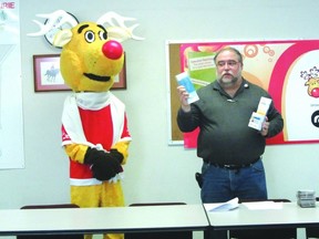 Organizer Leo Lapointe speaks as mascot Rudy looks on at the kick off Operation Red Nose at the Portage RCMP detachment, last Thursday.