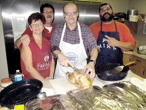 Judy and Ellwood Shreve, left, supervise the soup kitchen at Praise Fellowship Church in Chatham, Ont. They work along side with volunteer cooks Hans Weisshaar, centre, and Mike Rhan. Photo taken Tuesday, Dec. 18, 2012.(ELLWOOD SHREVE/ THE CHATHAM DAILY NEWS/ QMI AGENCY)