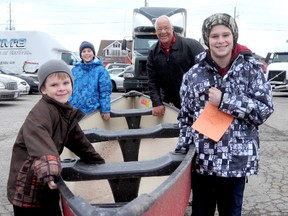 VICKI GOUGH vicki.gough@sunmedia.ca

It was all smiles at Chatham Towing as three brothers picked up an early Christmas gift from owner John Verkaik on Monday. The Campeau boys, Jacob, 7, left, Noah, 12, middle and Jesse, 14, right, are looking forward to fishing in the canoe this summer.