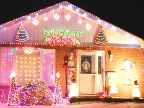 This Axmith Avenue home is completely covered with multi-coloured Christmas lights.
Photo by KEVIN McSHEFFREY/THE STANDARD/QMI AGENCY