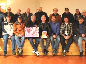 Some of Santa’s elves (Lions Club men) who were busy checking their lists before heading off to deliver toys to over 185 children throughout the area. Photo by Dawn Lalonde/Mid-North Monitor