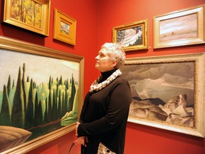 Lisa Daniels, curator of the Judith & Norman Alix Art Gallery, stands with pieces from the gallery's permanent collection, currently on display on the second floor of the new building in Sarnia, Ont.'s downtown. The county's public art gallery opened in October, 2012 at its new location. FILE PHOTO/ THE OBSERVER/ QMI AGENCY