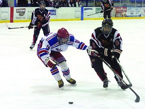 Fort Saskatchewan Bantam AAA Ranger defenceman Brydon Klingbeil tries to pull the puck away from a K of C Squire on Saturday during a 7-4 win for the local boys. With an added win over the Camrose Vikings on Sunday, the Rangers have earned a three-game winning streak.
Shane Jones/QMI Agency